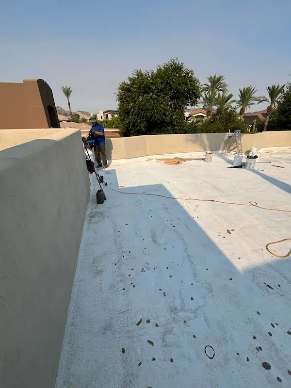 arizona flat roof company applying elastomeric coating