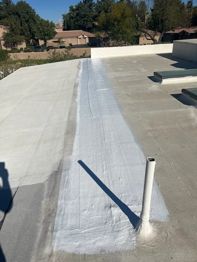 arizona flat roof company applying elastomeric coating