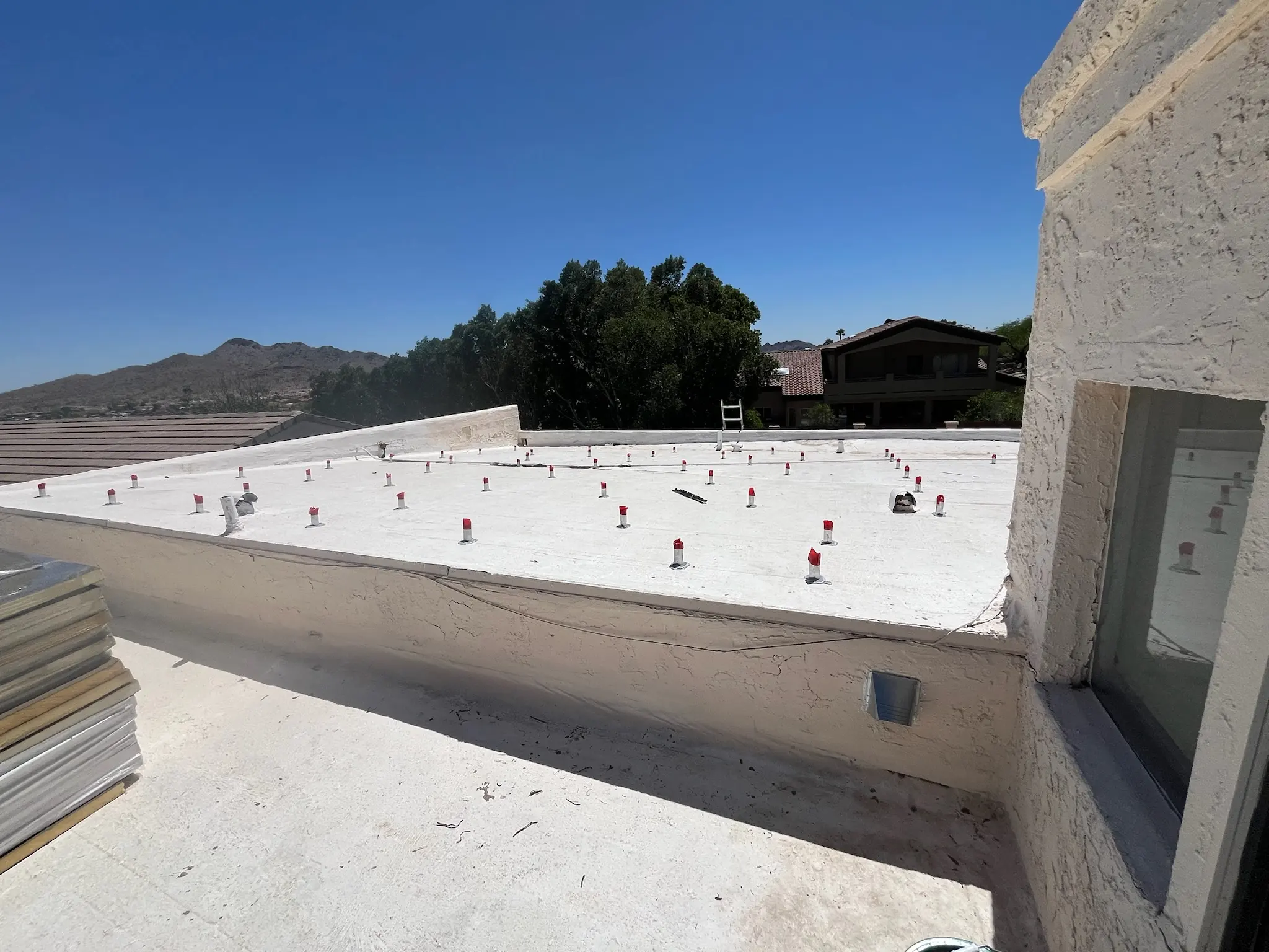 arizona flat roof company applying elastomeric coating
