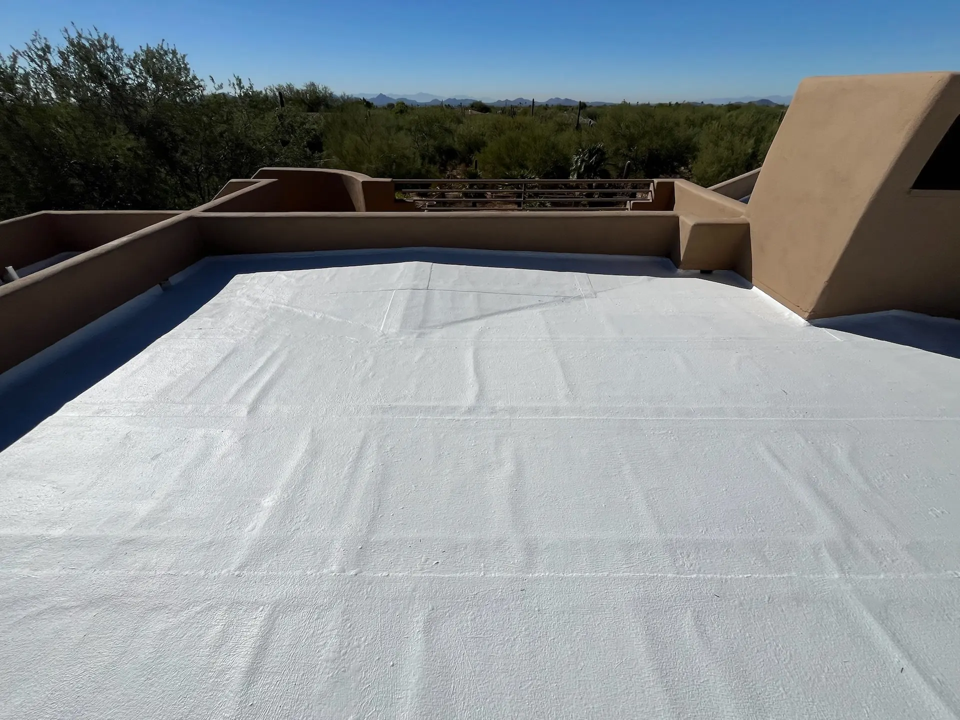 arizona flat roof company applying elastomeric coating