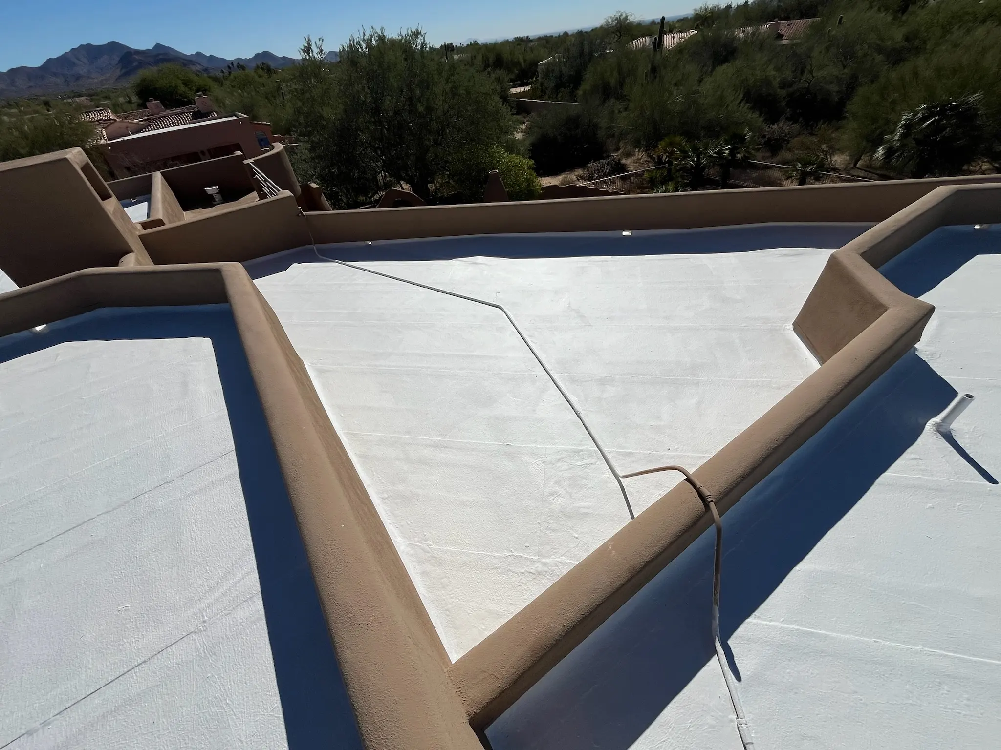 arizona flat roof company applying elastomeric coating