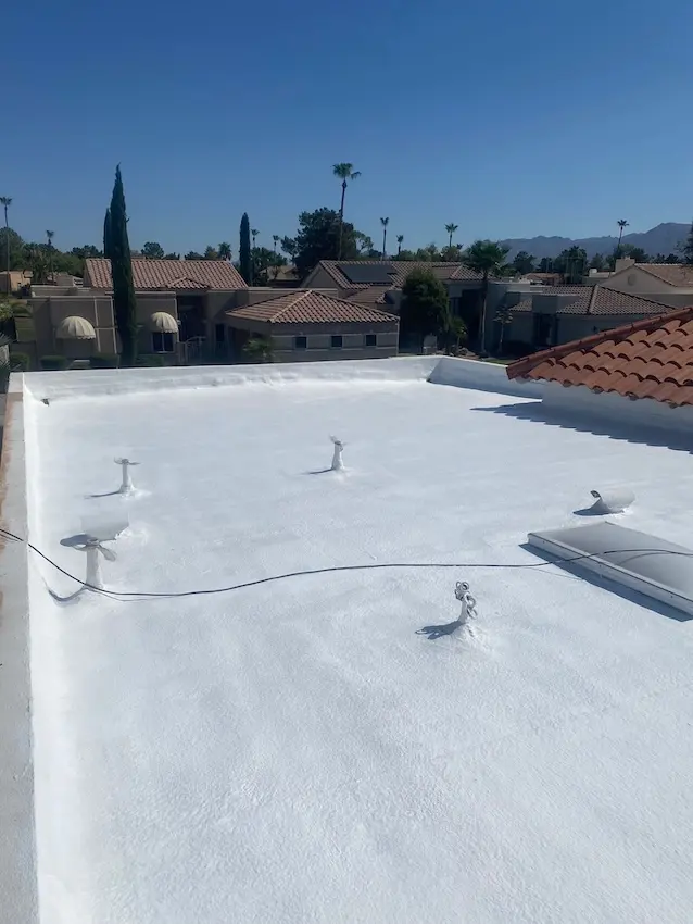 arizona flat roof company applying elastomeric coating